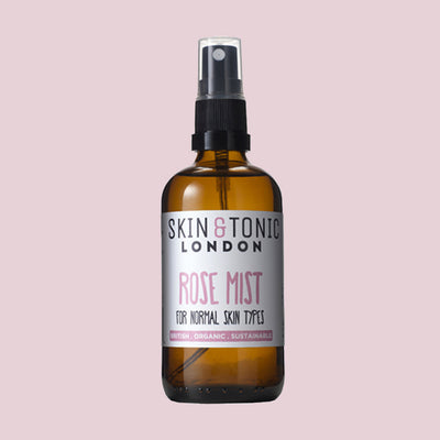 Skin & Tonic Rose Mist spray bottle on dusky pink background