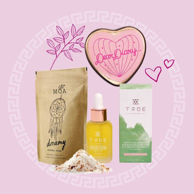 Picture collage featuring MOA Dreamy Mineral soak, True avocado and evening primrose oil, and Neighbourhood botanicals dear diary lip balm. Products placed on pink backdrop with leaf, circular pattern and heart graphics